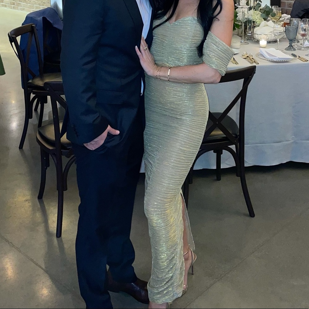 Beautiful, gold gown. Slit in the back. Off shoulder detailing.